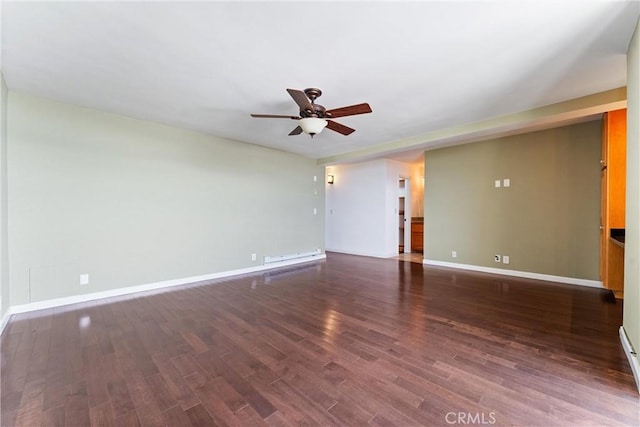 empty room with a ceiling fan, baseboards, and wood finished floors