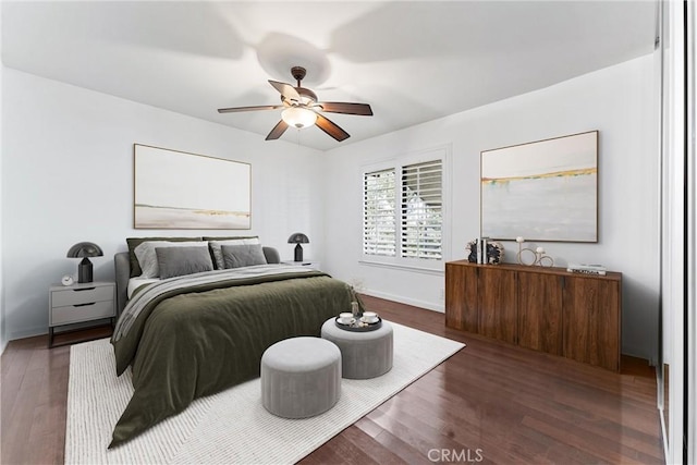 bedroom featuring dark wood finished floors and ceiling fan