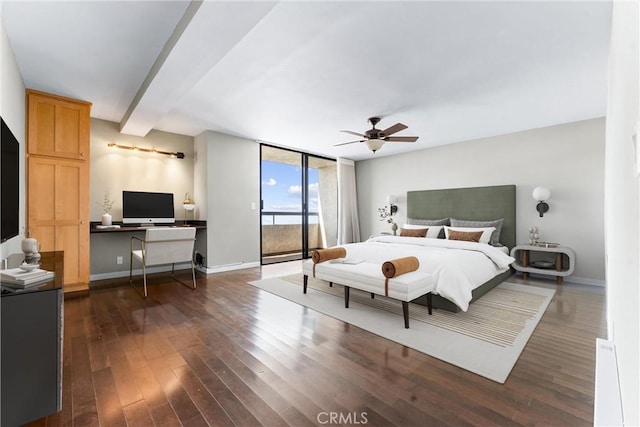 bedroom featuring dark wood-style flooring, a desk, access to exterior, a ceiling fan, and baseboards