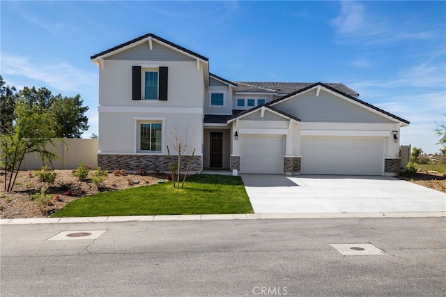 view of front facade featuring an attached garage, stone siding, concrete driveway, and fence