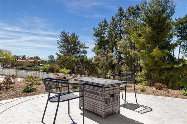 view of patio featuring fence