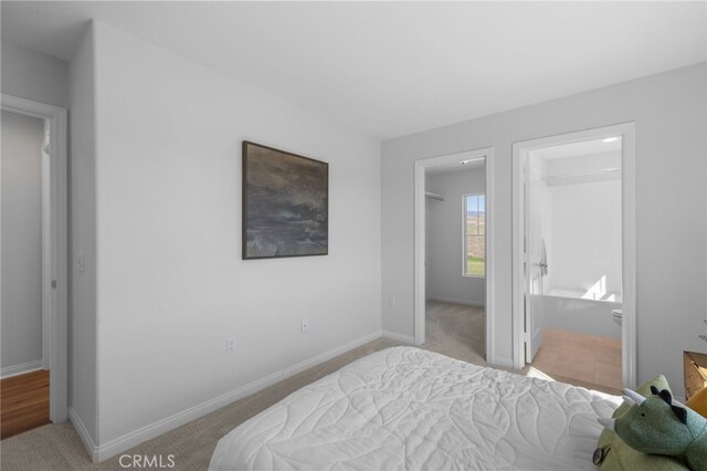 bedroom featuring carpet and baseboards