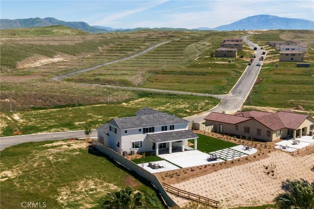 birds eye view of property featuring a rural view and a mountain view
