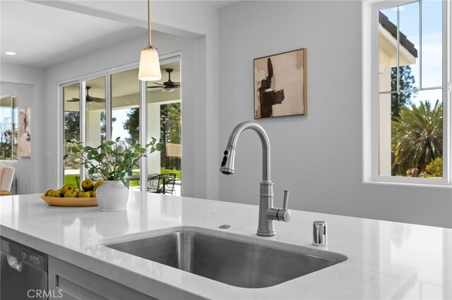 room details featuring a sink, ceiling fan, pendant lighting, dishwashing machine, and recessed lighting