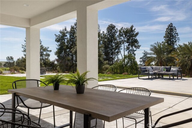 view of patio / terrace featuring outdoor dining area and an outdoor hangout area
