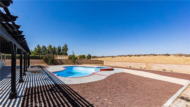 view of swimming pool featuring a fenced backyard, a patio, and a pool with connected hot tub