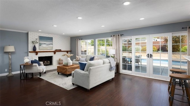 living area with dark wood-style flooring, french doors, and recessed lighting