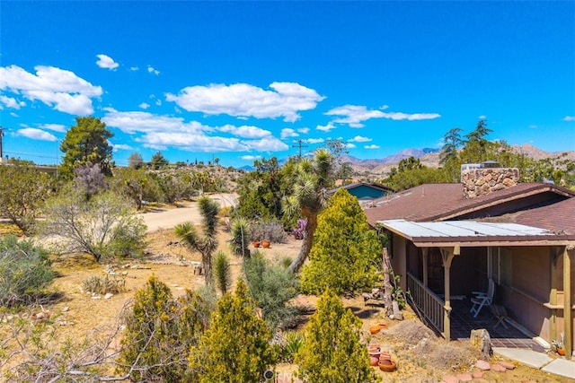 7890 Mariposa Trl, Yucca Valley, CA 92284 - view of yard with a sunroom and a mountain view