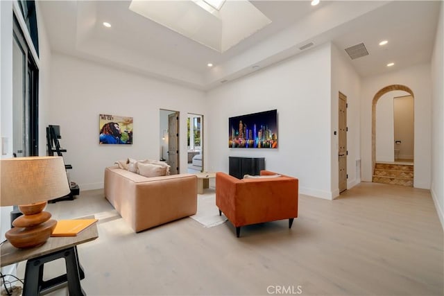 living room with visible vents, recessed lighting, and light wood-style floors