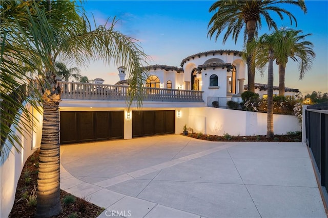 1090 Vista Ridge Ln, Westlake Village, CA 91362 - patio terrace at dusk with a balcony and a garage