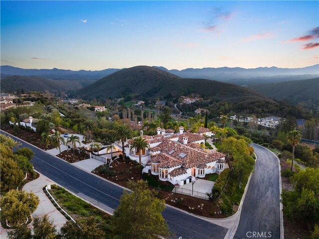 aerial view at dusk with a mountain view