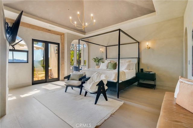 1090 Vista Ridge Ln, Westlake Village, CA 91362 - bedroom featuring wood finished floors, access to exterior, french doors, a chandelier, and a raised ceiling