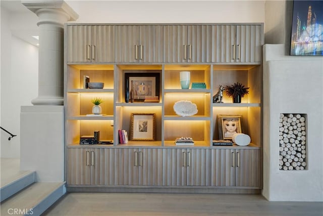 room details with wood finished floors and decorative columns