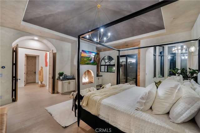 1090 Vista Ridge Ln, Westlake Village, CA 91362 - bedroom featuring a chandelier, a raised ceiling, wood finished floors, and baseboards