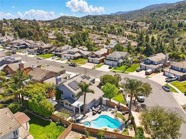 drone / aerial view featuring a mountain view and a residential view