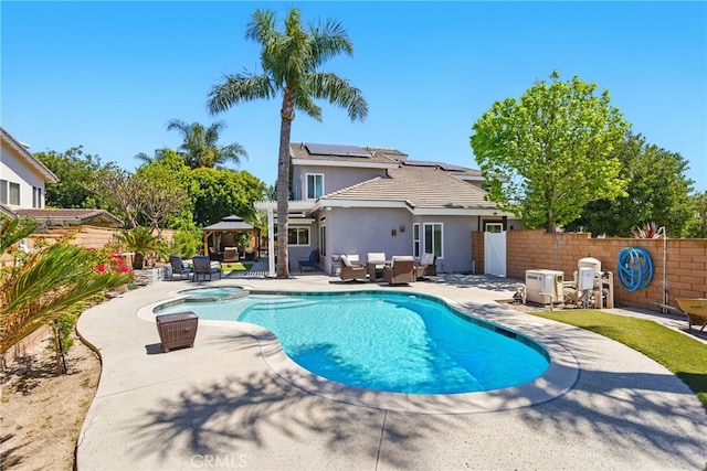 view of pool featuring an outdoor hangout area, a gazebo, a fenced backyard, and a patio area