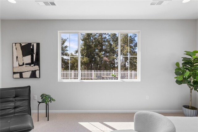 sitting room featuring baseboards, carpet flooring, and visible vents
