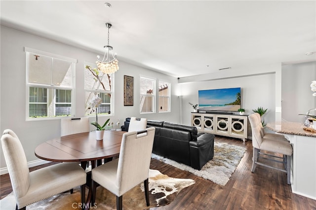 dining space featuring dark wood finished floors