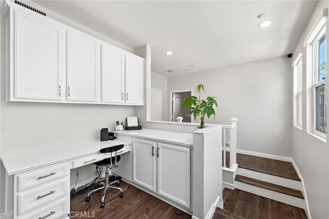 office featuring dark wood finished floors, built in study area, baseboards, and recessed lighting