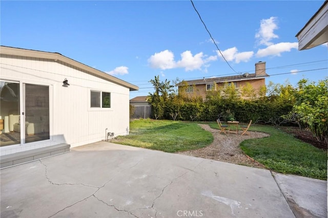 view of yard with a patio area and fence