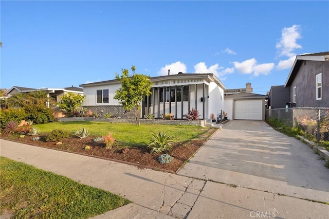 ranch-style house featuring driveway, a front yard, stucco siding, and fence