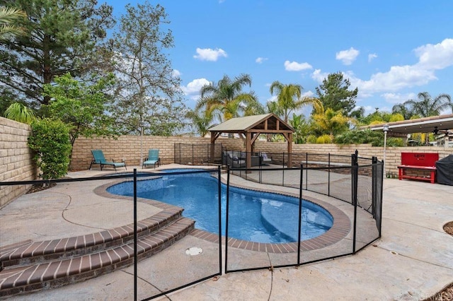 view of pool featuring a fenced backyard, a gazebo, and a patio