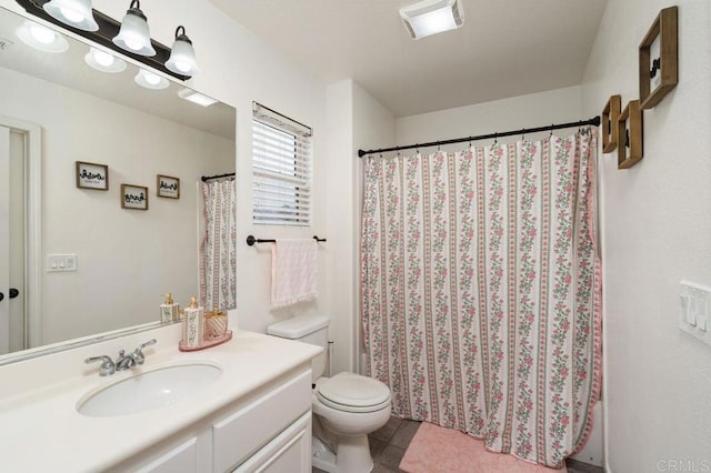 bathroom with visible vents, vanity, a shower with shower curtain, and toilet