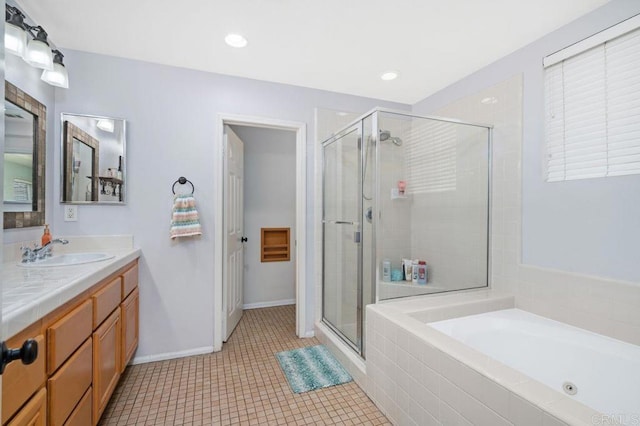 bathroom with a stall shower, tile patterned flooring, a bath, and vanity