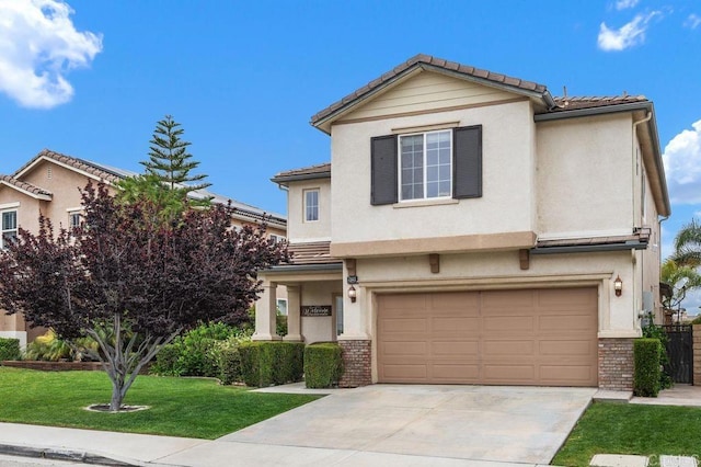 traditional home featuring brick siding, a front yard, an attached garage, and a tiled roof