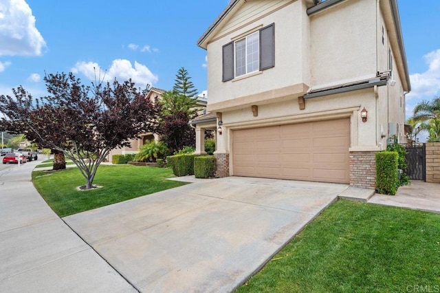 view of front of home featuring stucco siding, an attached garage, concrete driveway, and a front lawn