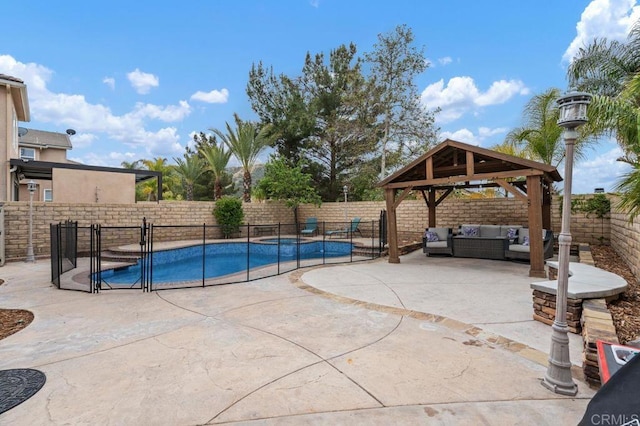view of pool featuring a patio, an outdoor living space, a fenced in pool, a fenced backyard, and a gazebo