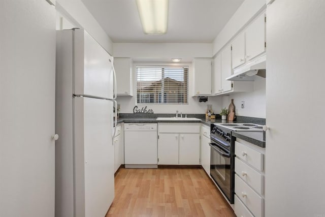 1038 Eider Way, Oceanside, CA 92057 - kitchen featuring white appliances, under cabinet range hood, dark countertops, a sink, and white cabinets
