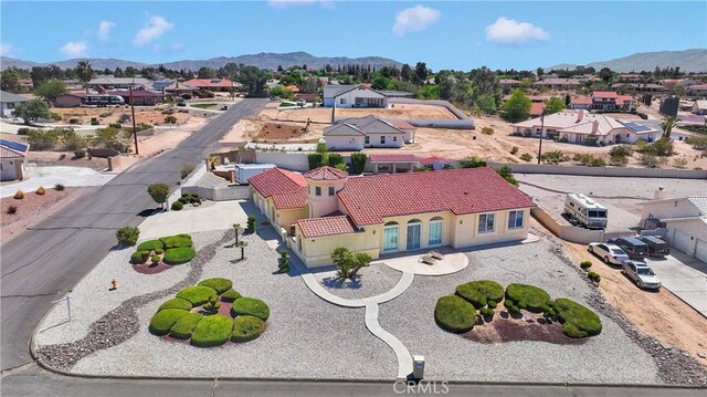 drone / aerial view with a residential view and a mountain view