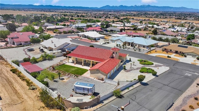 birds eye view of property with a residential view and a mountain view