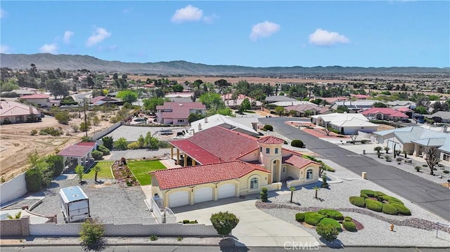 drone / aerial view with a residential view and a mountain view