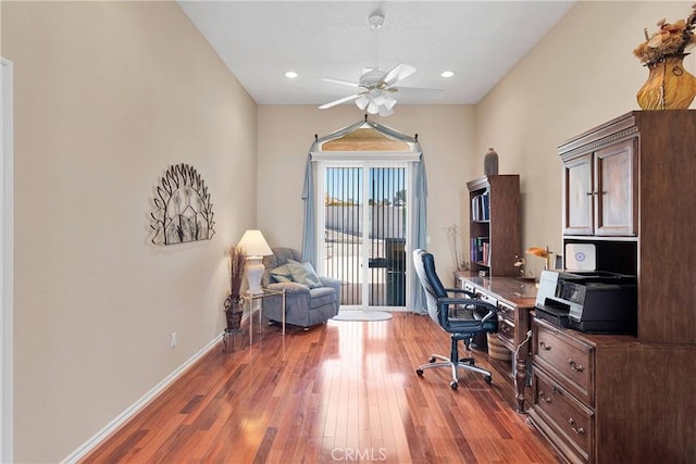 office featuring baseboards, a ceiling fan, wood finished floors, and recessed lighting