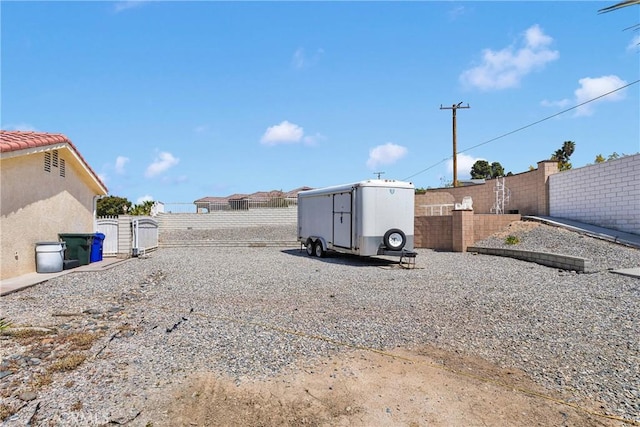 view of yard featuring a gate and a fenced backyard