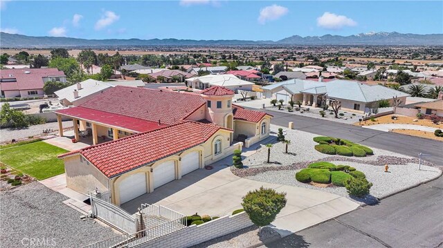 drone / aerial view featuring a mountain view and a residential view