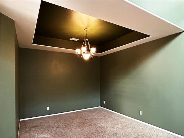 5743 Kendall Ct, Rancho Cucamonga, CA 91739 - carpeted spare room with a raised ceiling, a chandelier, and baseboards