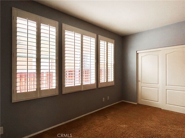 5743 Kendall Ct, Rancho Cucamonga, CA 91739 - unfurnished bedroom with carpet, a closet, and baseboards