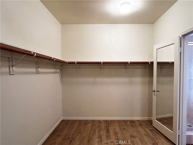 5743 Kendall Ct, Rancho Cucamonga, CA 91739 - walk in closet with wood finished floors