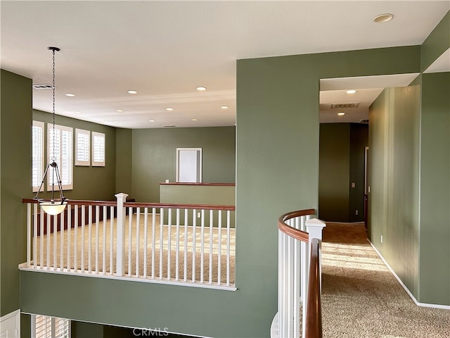 5743 Kendall Ct, Rancho Cucamonga, CA 91739 - hall with carpet flooring, recessed lighting, and an upstairs landing