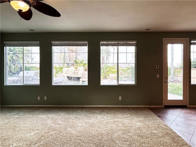 5743 Kendall Ct, Rancho Cucamonga, CA 91739 - foyer entrance featuring plenty of natural light, baseboards, tile patterned flooring, and ceiling fan