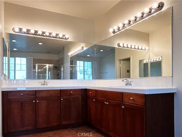 5743 Kendall Ct, Rancho Cucamonga, CA 91739 - bathroom featuring a shower stall, vanity, and tile patterned flooring