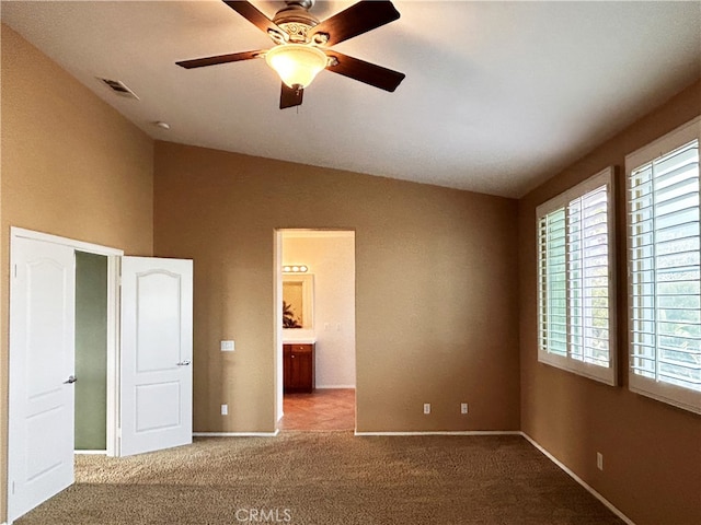 5743 Kendall Ct, Rancho Cucamonga, CA 91739 - unfurnished bedroom with lofted ceiling, multiple windows, carpet flooring, baseboards, and a ceiling fan