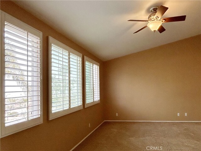 5743 Kendall Ct, Rancho Cucamonga, CA 91739 - carpeted spare room with baseboards, ceiling fan, and vaulted ceiling