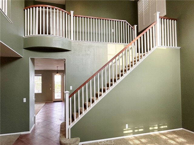 5743 Kendall Ct, Rancho Cucamonga, CA 91739 - staircase with baseboards and tile patterned floors