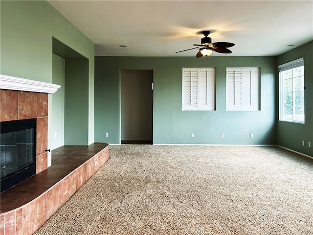 5743 Kendall Ct, Rancho Cucamonga, CA 91739 - unfurnished living room featuring carpet floors, a fireplace, ceiling fan, and baseboards