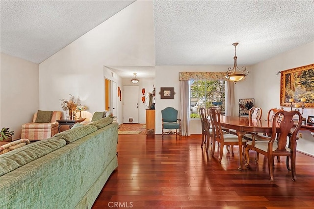 19852 Pandy Ct, Canyon Country, CA 91351 - dining area with lofted ceiling, a textured ceiling, and wood-type flooring