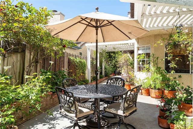 19852 Pandy Ct, Canyon Country, CA 91351 - view of patio featuring fence, outdoor dining space, and a pergola